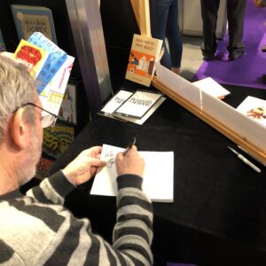 Michael Rosen signing books